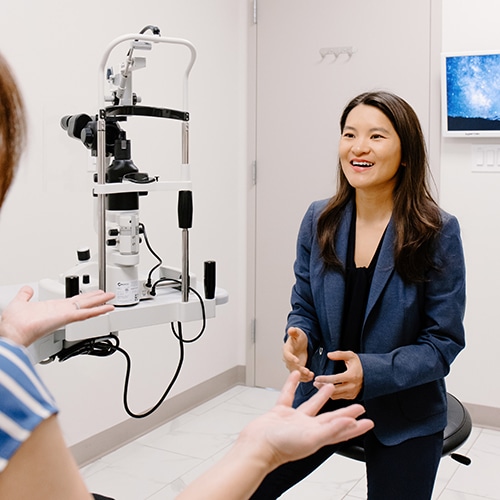 Dr. Zhou Speaking With a Patient